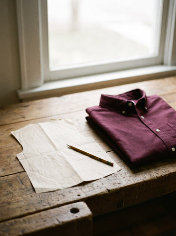Work table with a shirt pattern and pencil