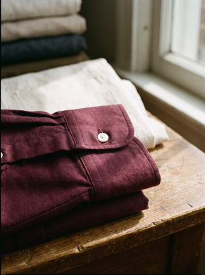 Close detail of deep burgundy brushed cotton oxford weave