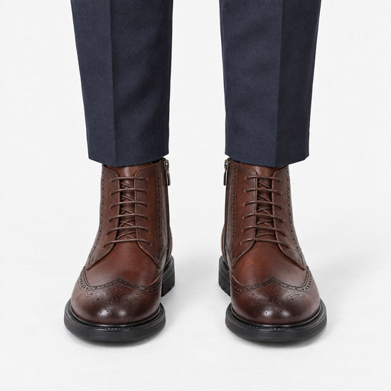 Leather wingtip boots with side zips