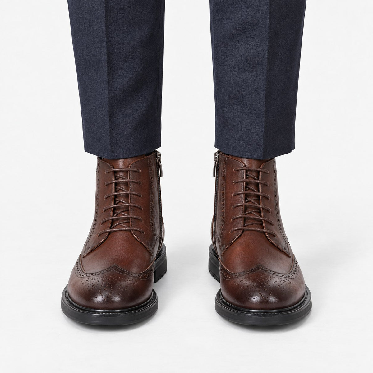 Leather wingtip boots with side zips