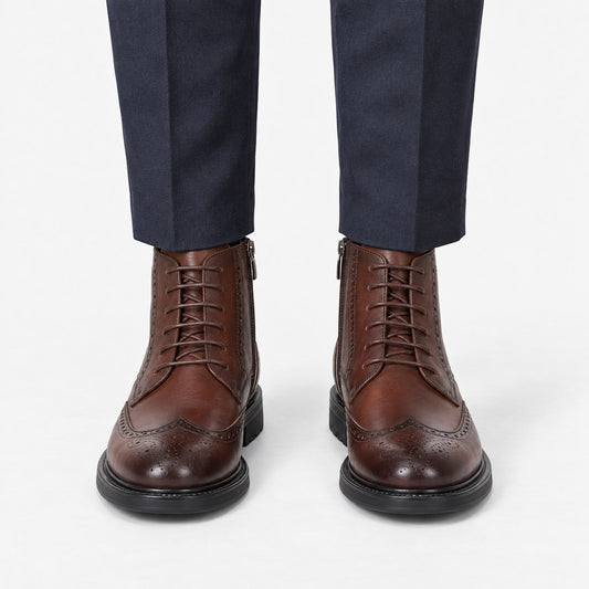 Leather wingtip boots with side zips