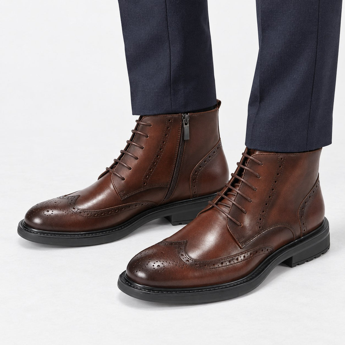 Leather wingtip boots with side zips