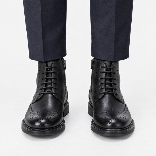 Leather wingtip boots with side zips