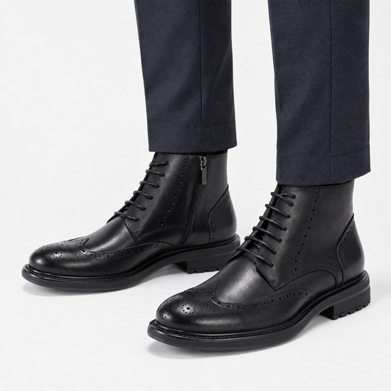 Leather wingtip boots with side zips