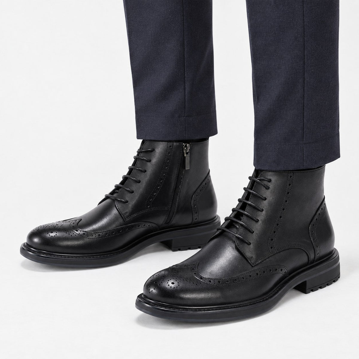 Leather wingtip boots with side zips