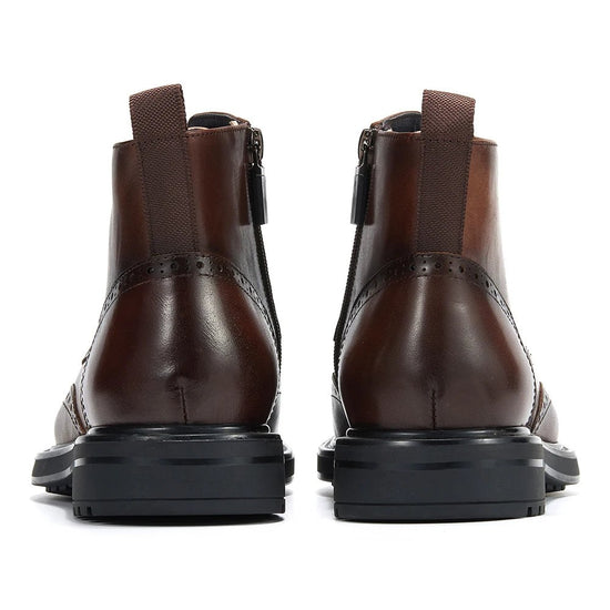 Leather wingtip boots with side zips