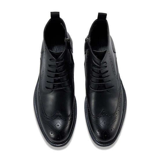 Leather wingtip boots with side zips