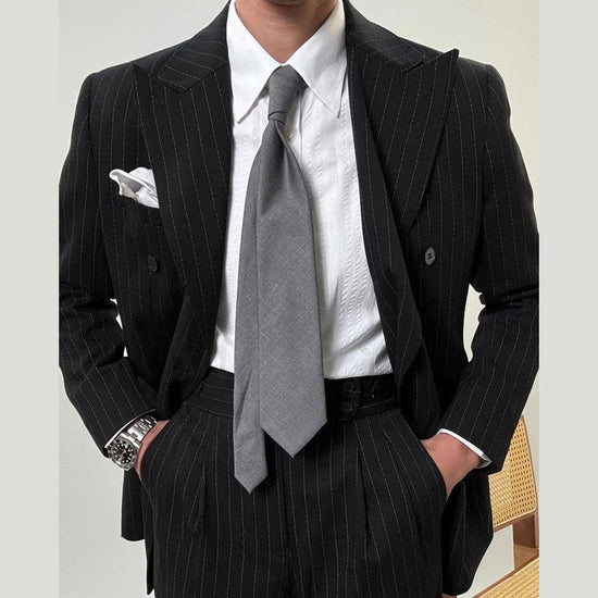 Leo grooms elegant suit