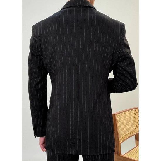 Leo grooms elegant suit