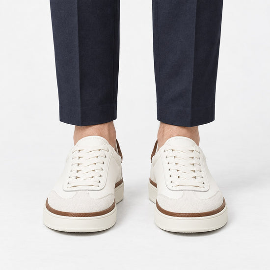 White leather sneakers with brown trim