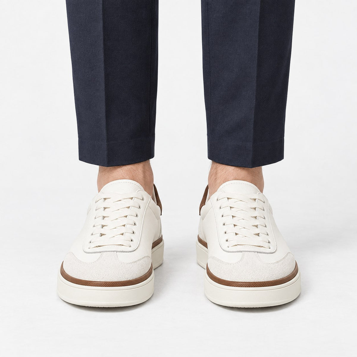 White leather sneakers with brown trim