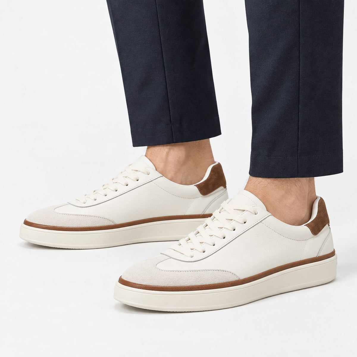 White leather sneakers with brown trim